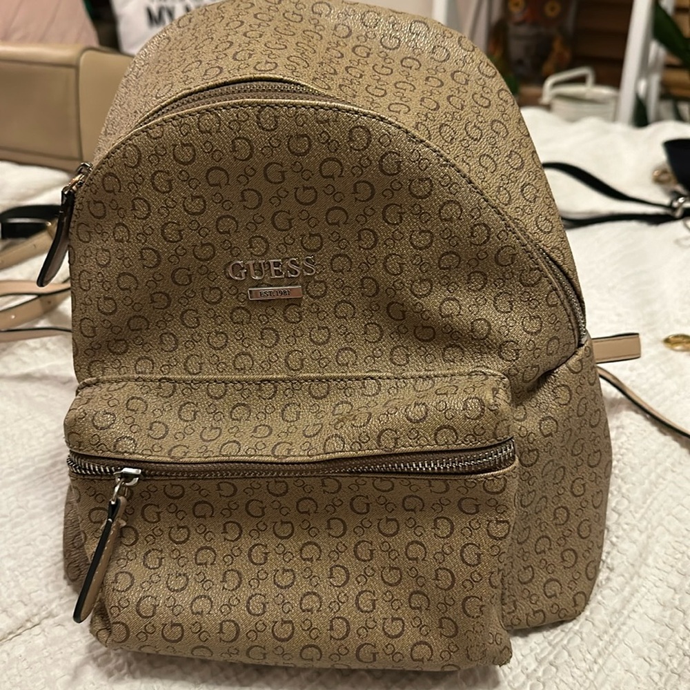 Guess tan backpack.